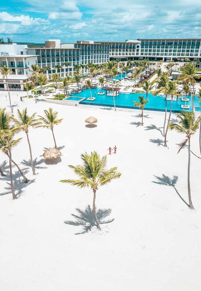 drone shot of two people on the beach